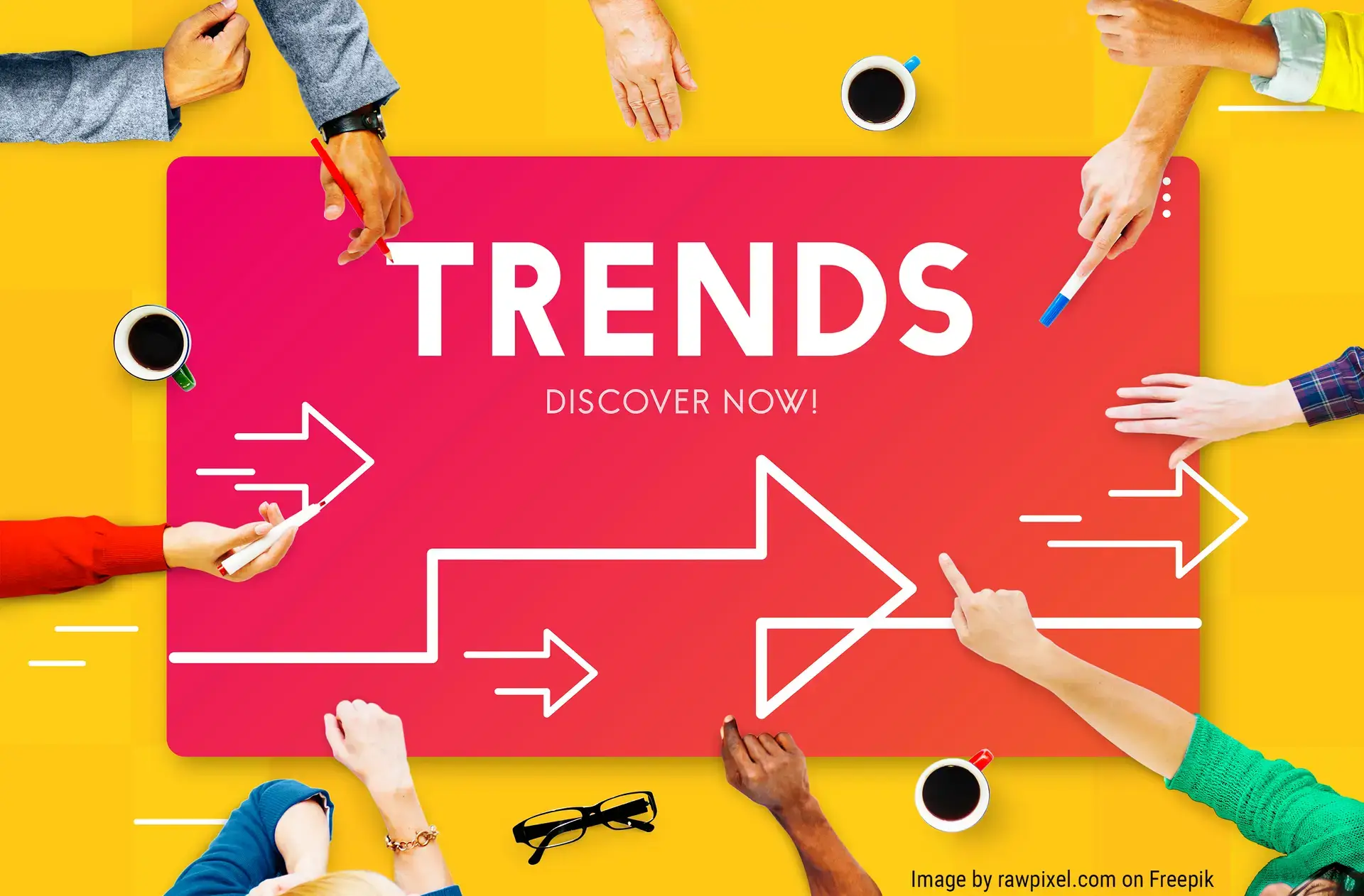 hands pointing to sign that reads Trends Discover Now